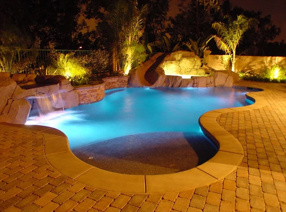Lit waterfall at night