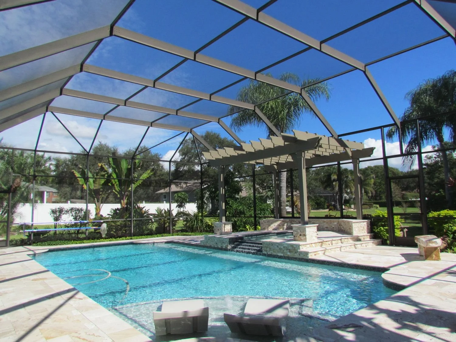 Screened pool with pergola in Dunedin