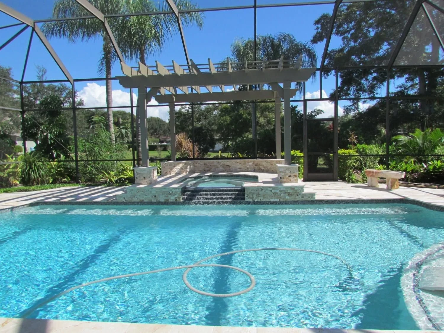 Screened pool with pergola in the Dog Days service area