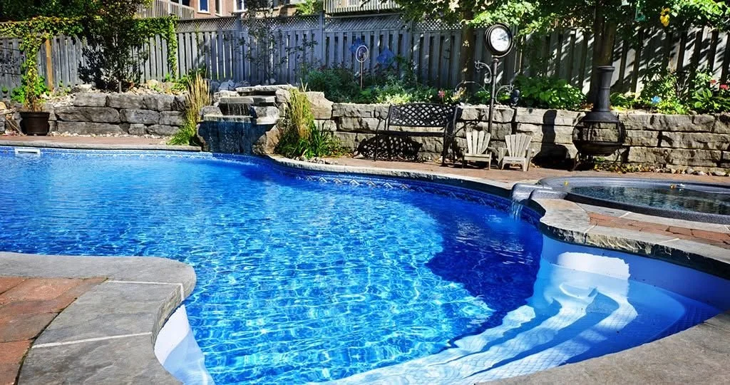 Freeform pool with clear blue water