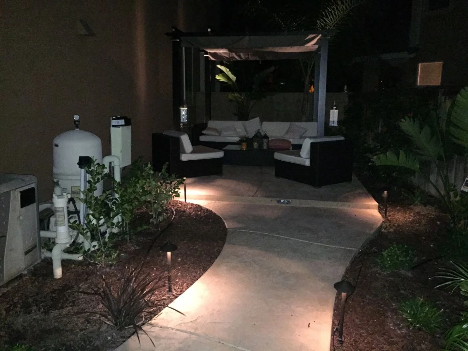 Backyard pool patio at night