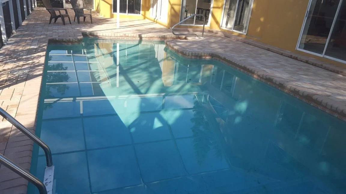 Still pool reflecting an empty house