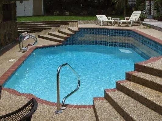 Pool entry steps checked during a home-buyer inspection in Clearwater, FL