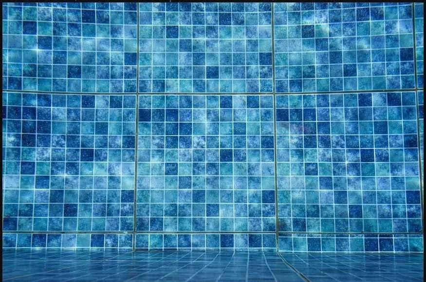 Clear pool water over mosaic tile