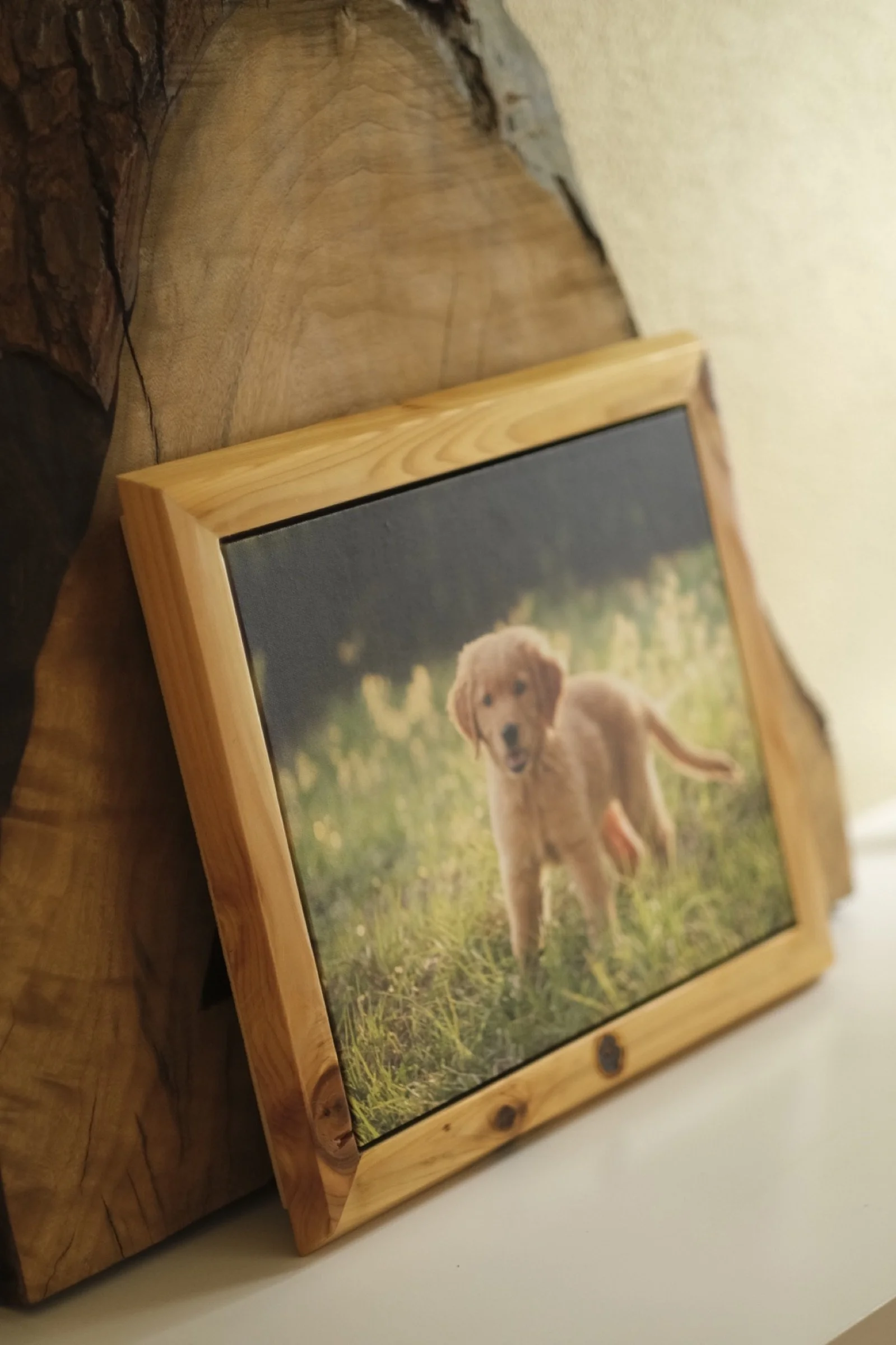 Detail of a handcrafted wood frame and canvas portrait