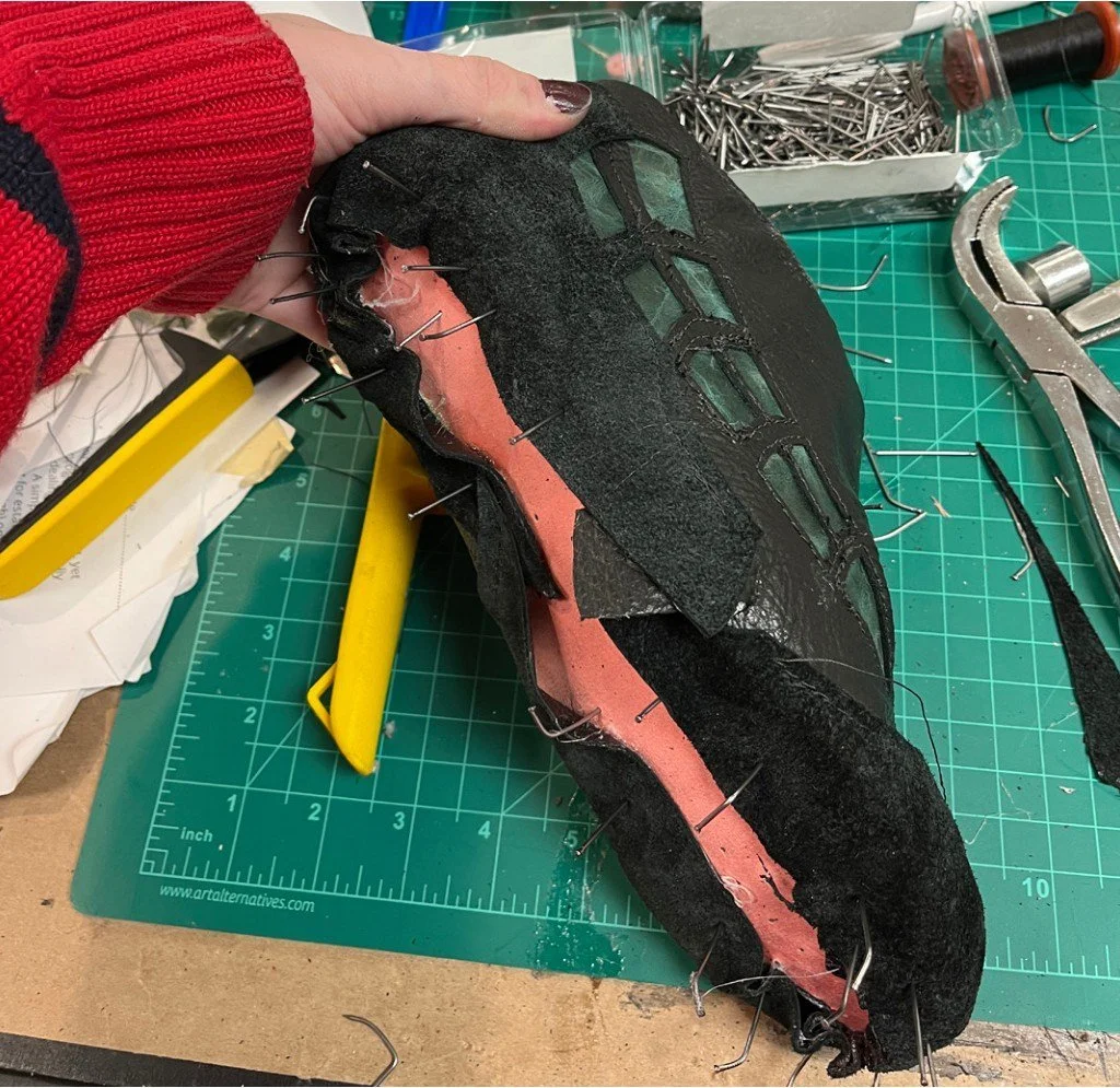 Nailing bottom of shoe into last