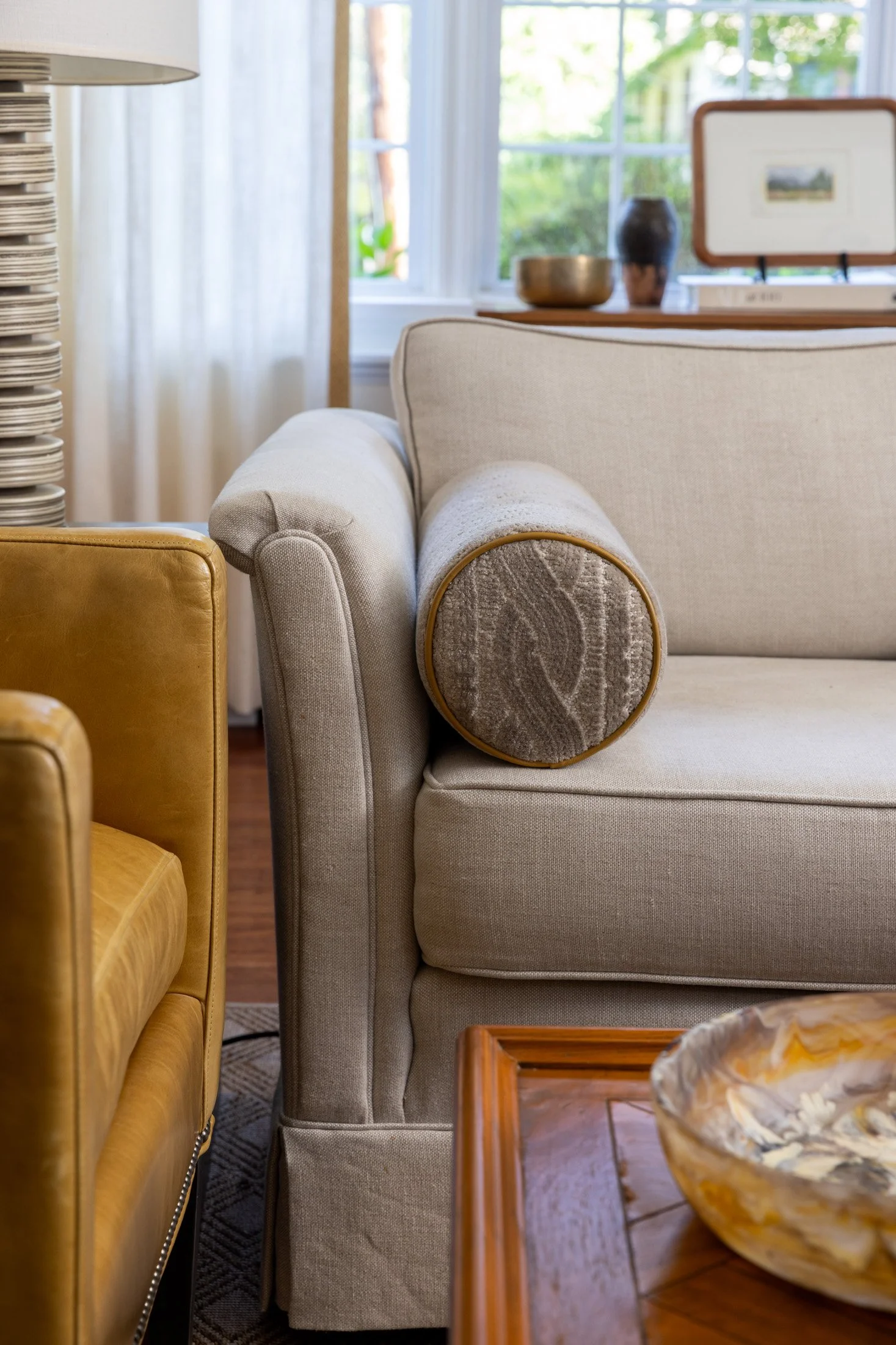 Upholstery and bolster detail on a cream living room sofa