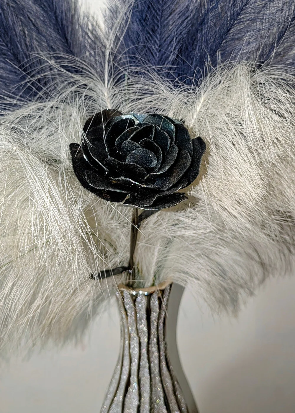Eric J. Cox’s dark metal rose sculpture with layered petals