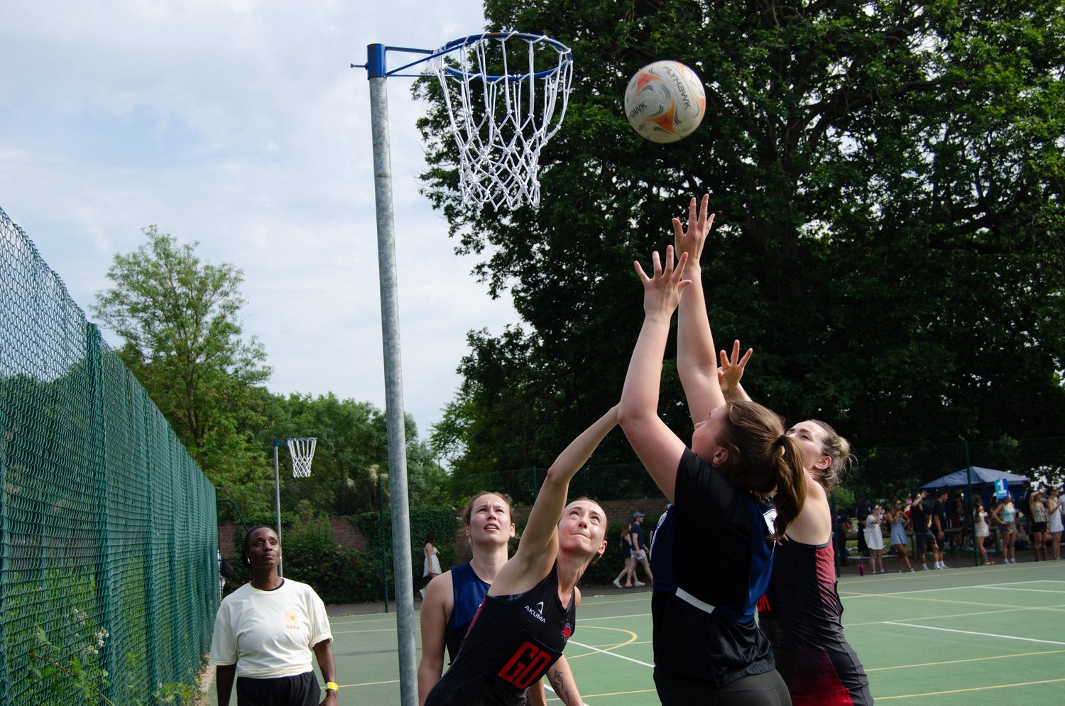 Netball players contesting a shot at Summer Social