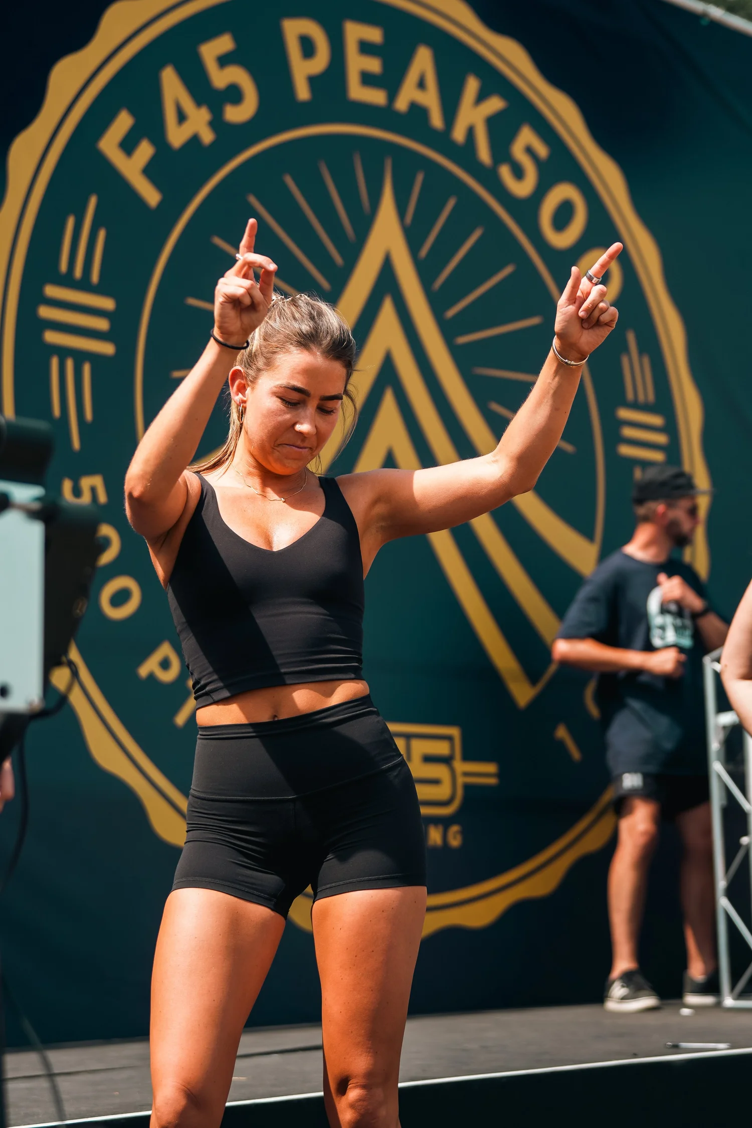 F45 PEAK500 athlete competing in front of the event backdrop