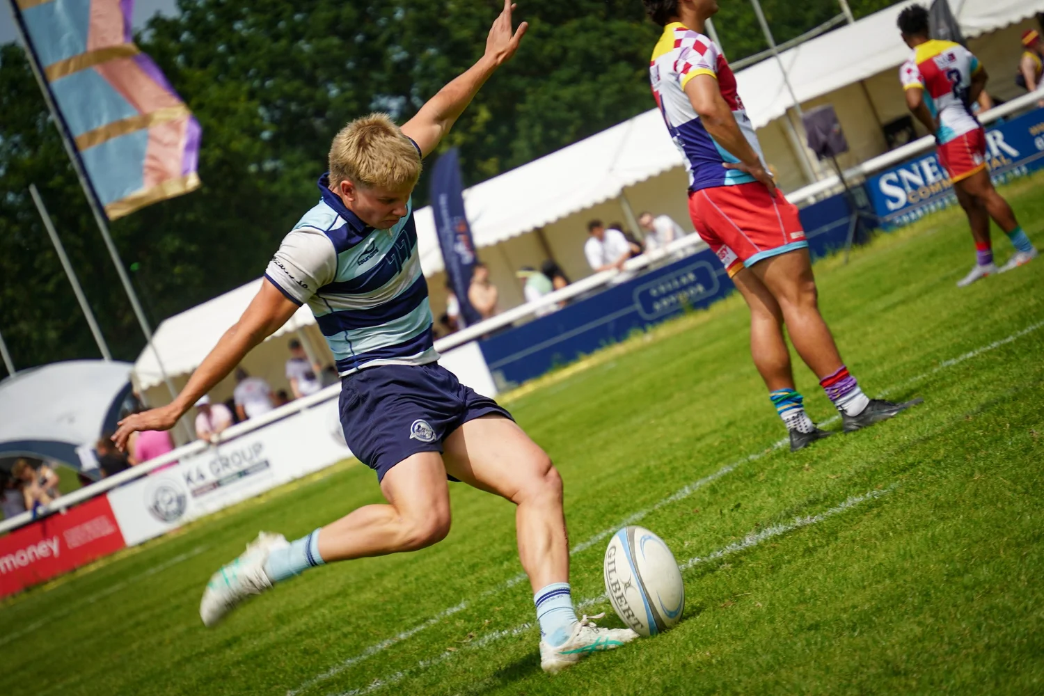 Rugby sevens player kicking at Summer Social