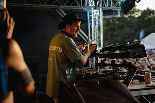 A DJ performing for the Summer Social audience