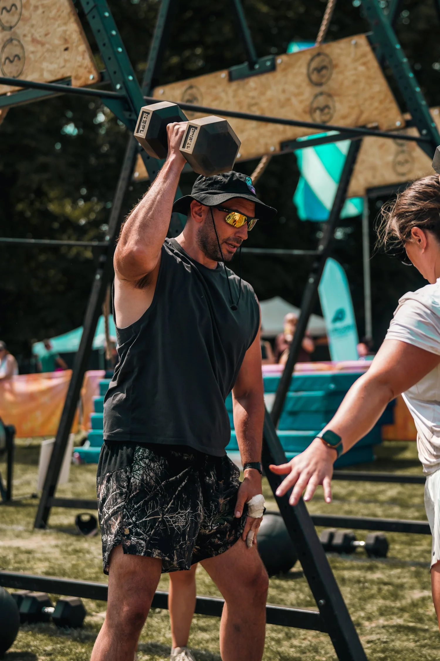 F45 competitor lifting a dumbbell at Summer Social