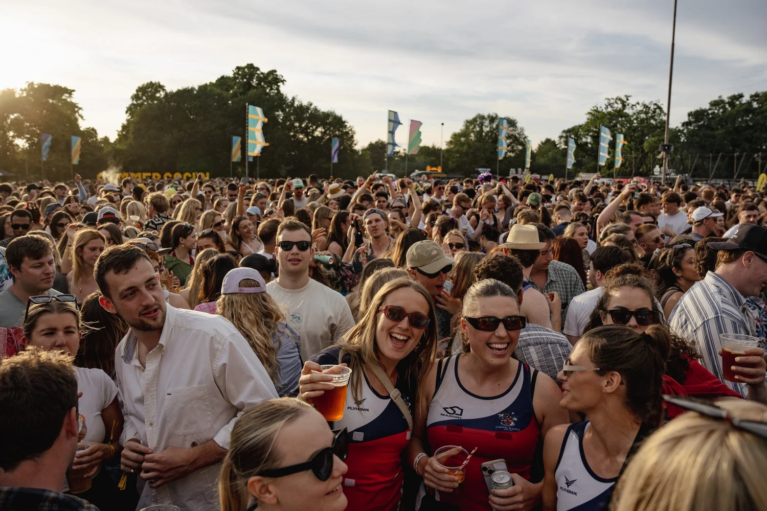 Friends enjoying the Summer Social festival crowd