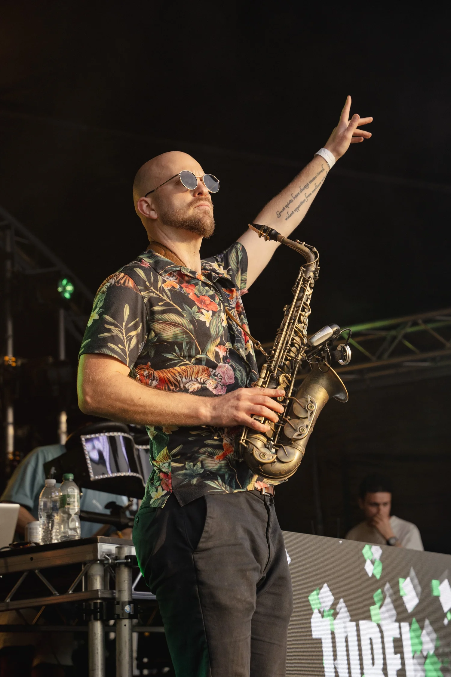 A saxophonist performing on the Main Stage at Summer Social