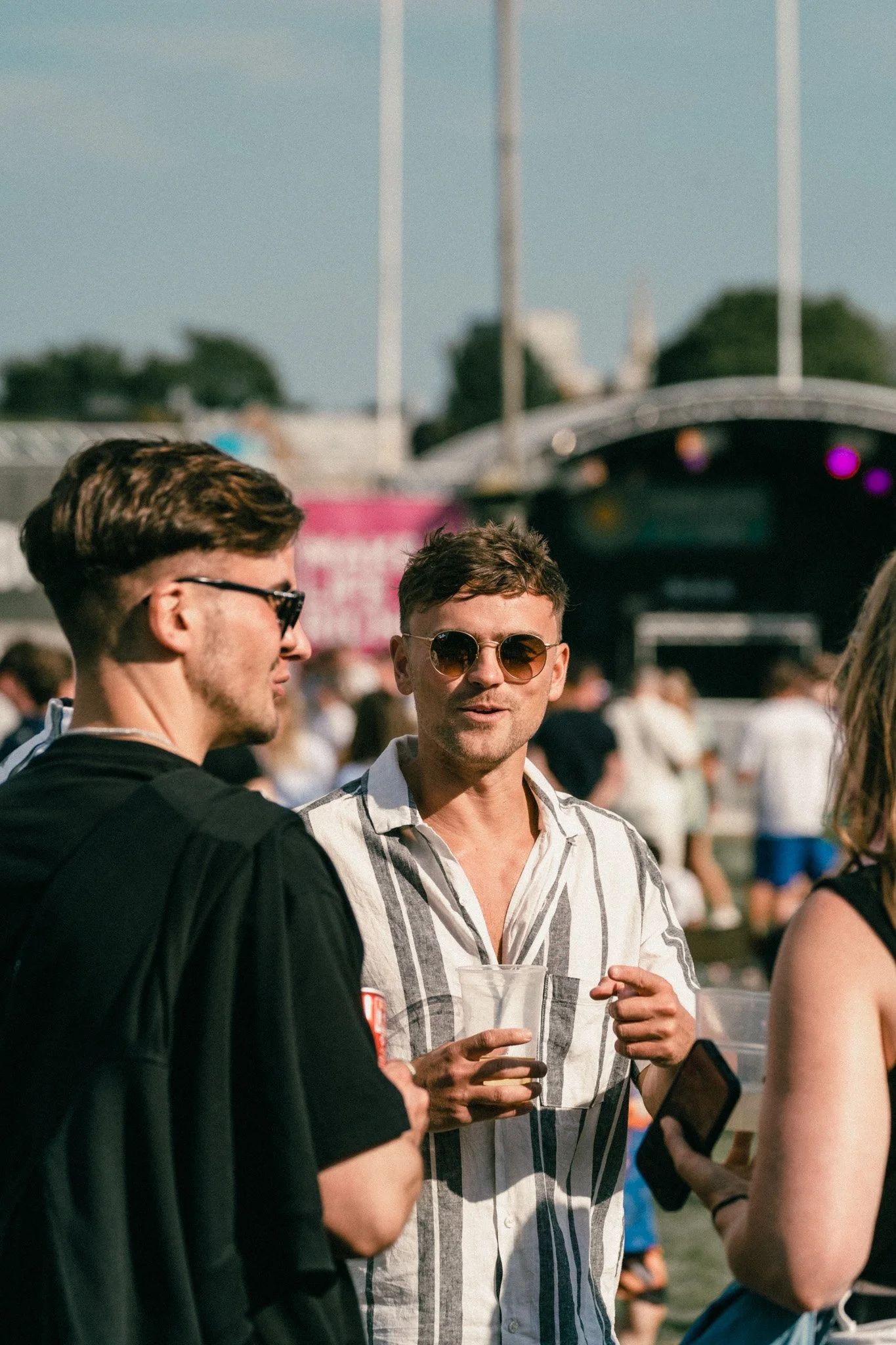 Friends socialising with drinks at Summer Social