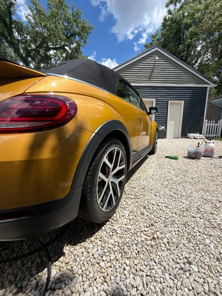 Drive N Shine detailing a car at a customer's home