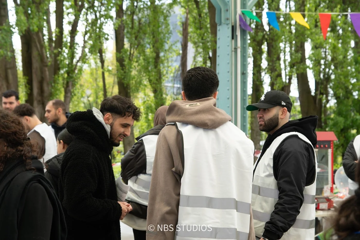 Make A Kid Happy volunteers in vests getting ready for the Eid Festival