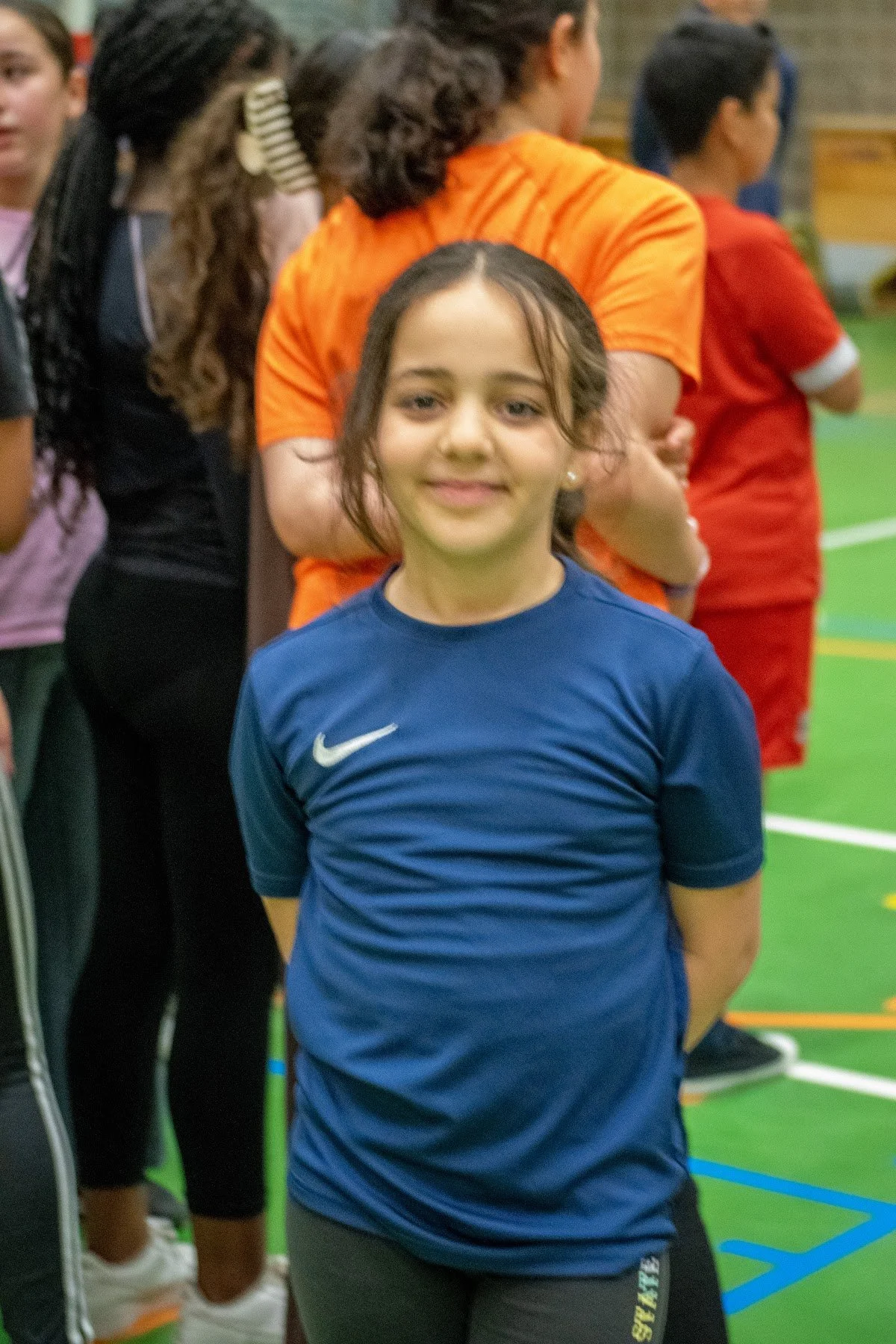 A smiling girl at a Make A Kid Happy sports day