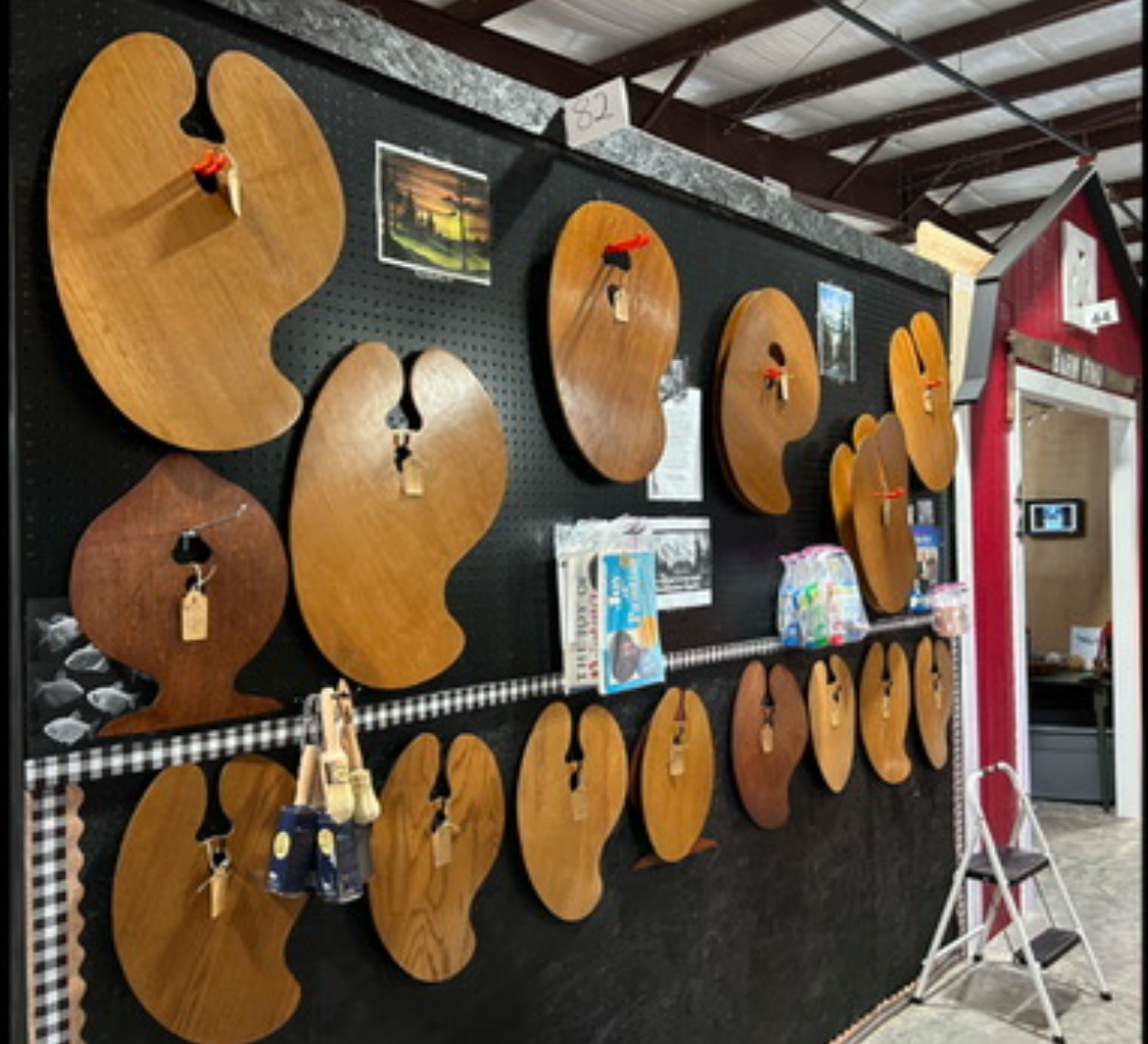 Johnny’s handmade wooden palettes displayed in a variety of shapes and finishes