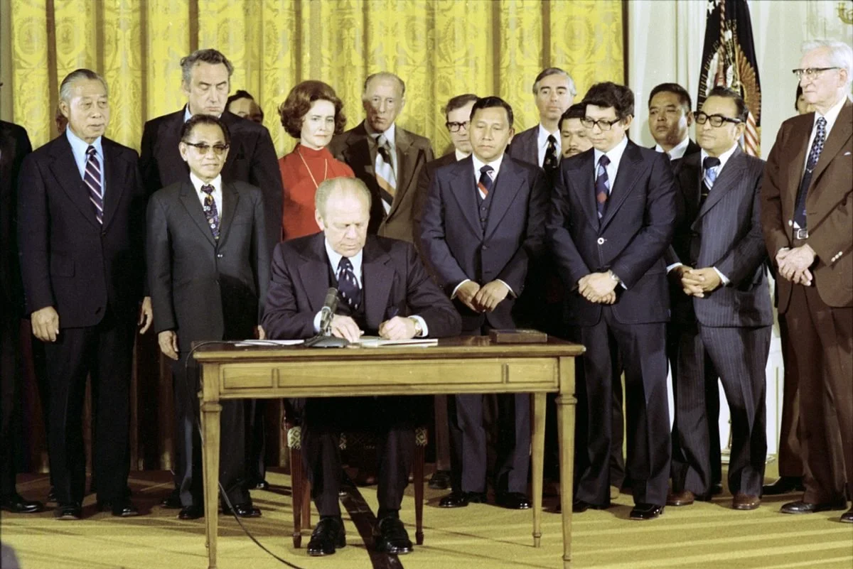 President Ford signs the Covenant with the Northern Mariana Islands