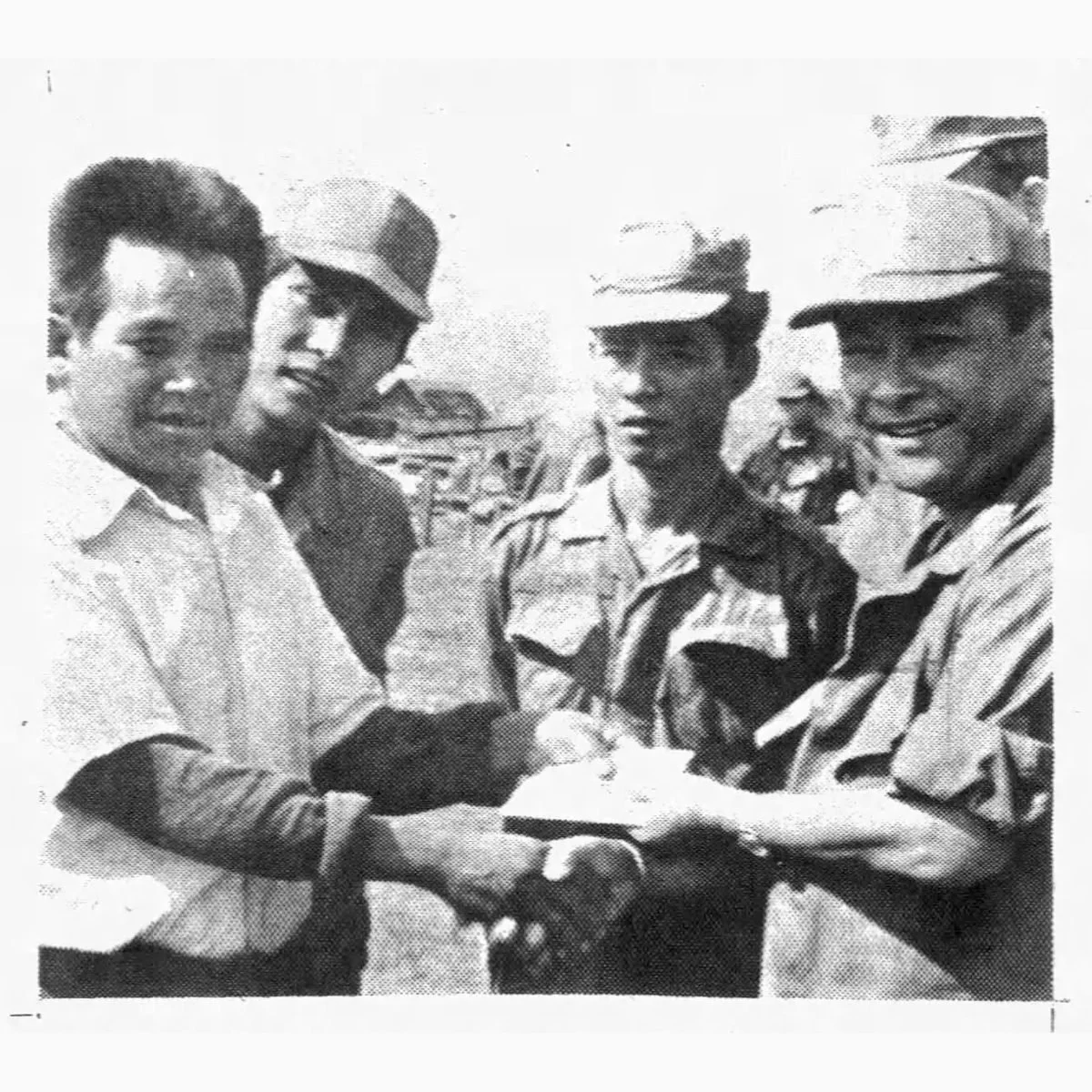 Guam Daily News, December 31, 1969: men shake hands in Vietnam
