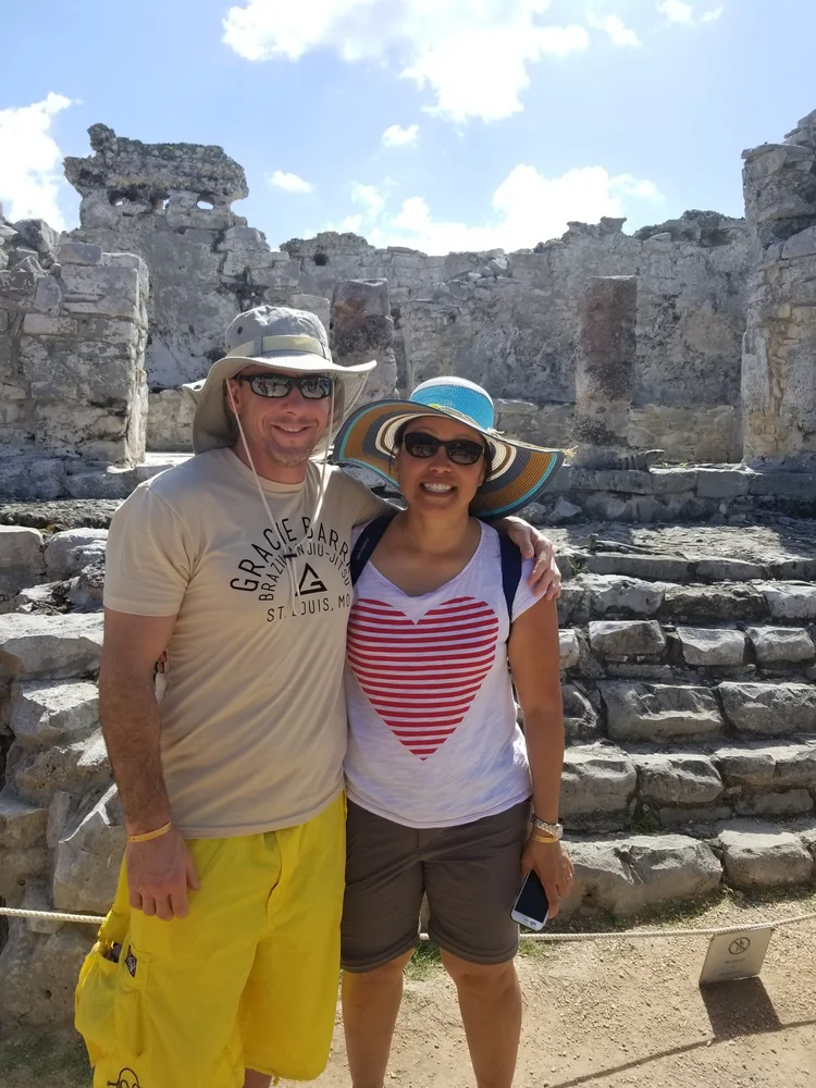 A couple in front of Maya ruins near Playa del Carmen, Mexico