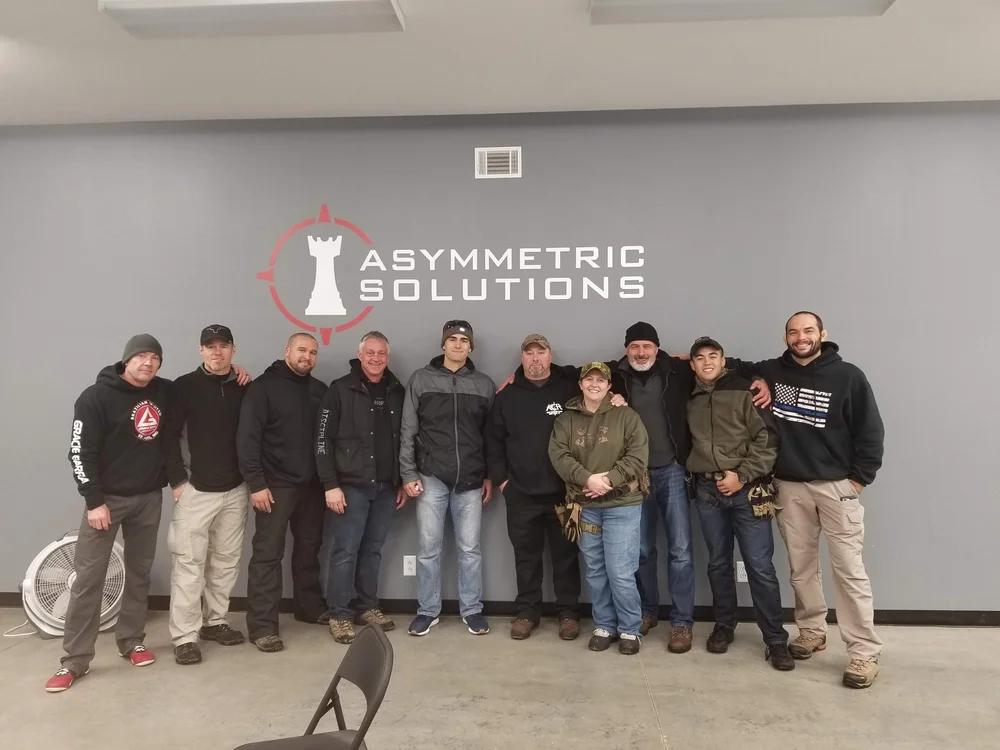 Training group photo at Asymmetric Solutions