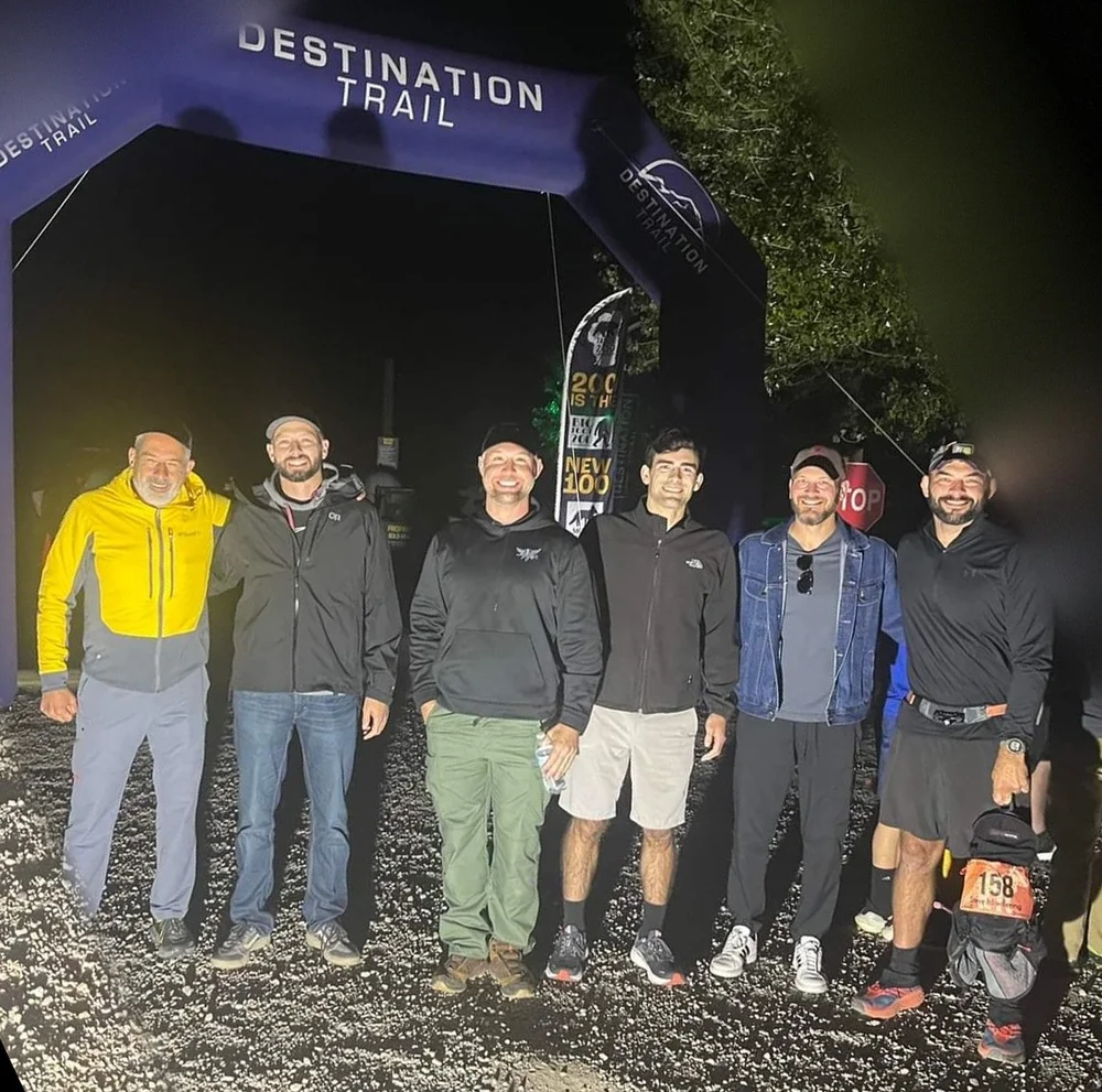 Nick and friends at the Destination Trail start arch, Moab 240, 2022