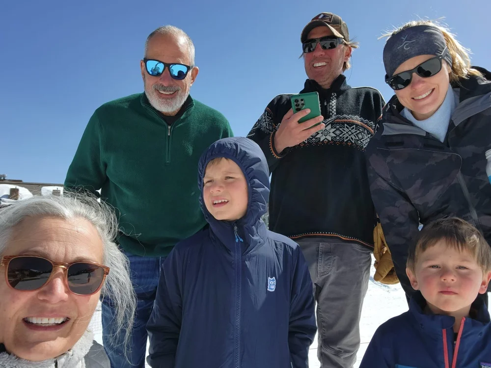 Nick with family on a sunny snow day