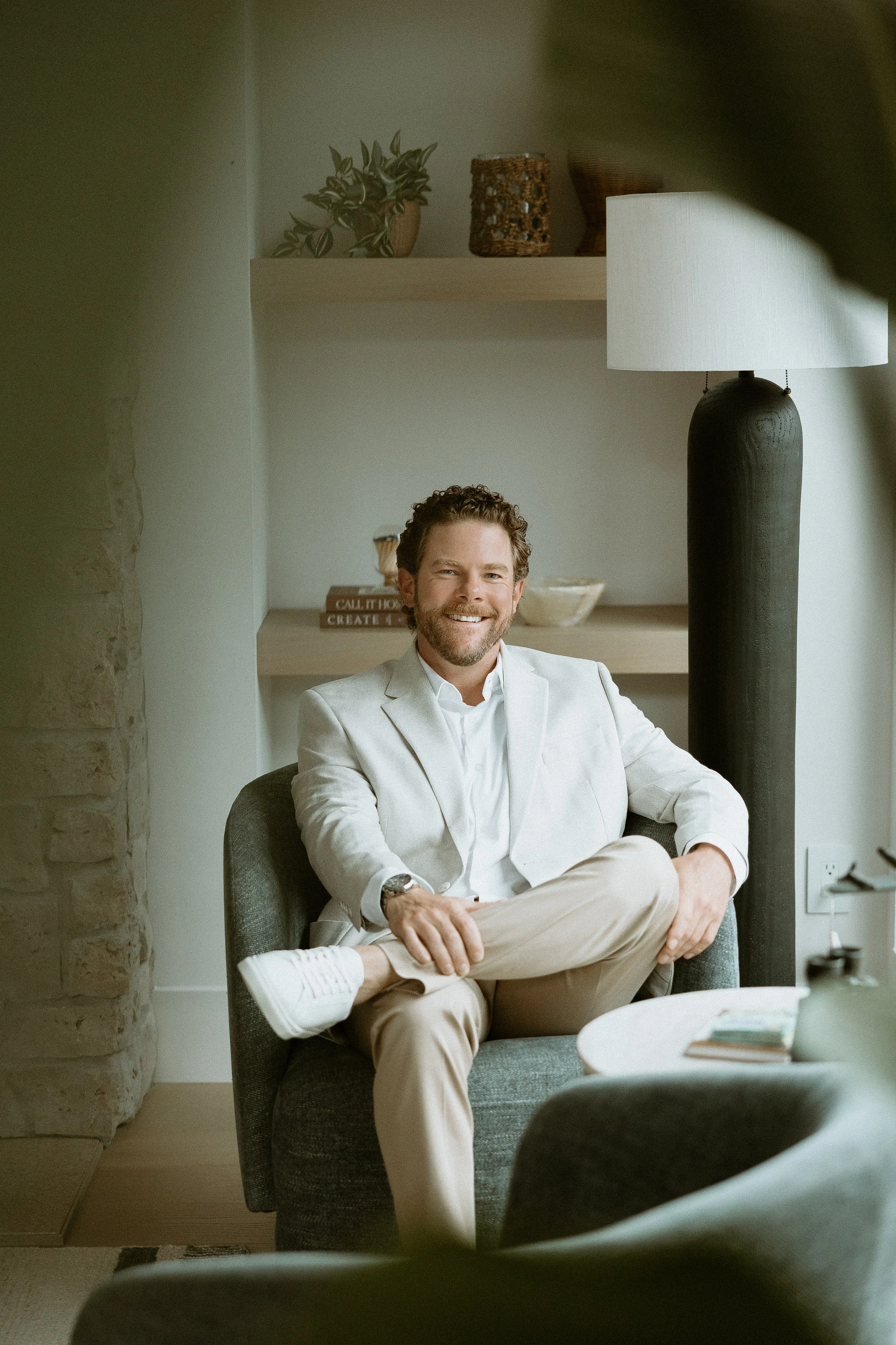 Matt Hefti seated in a light blazer
