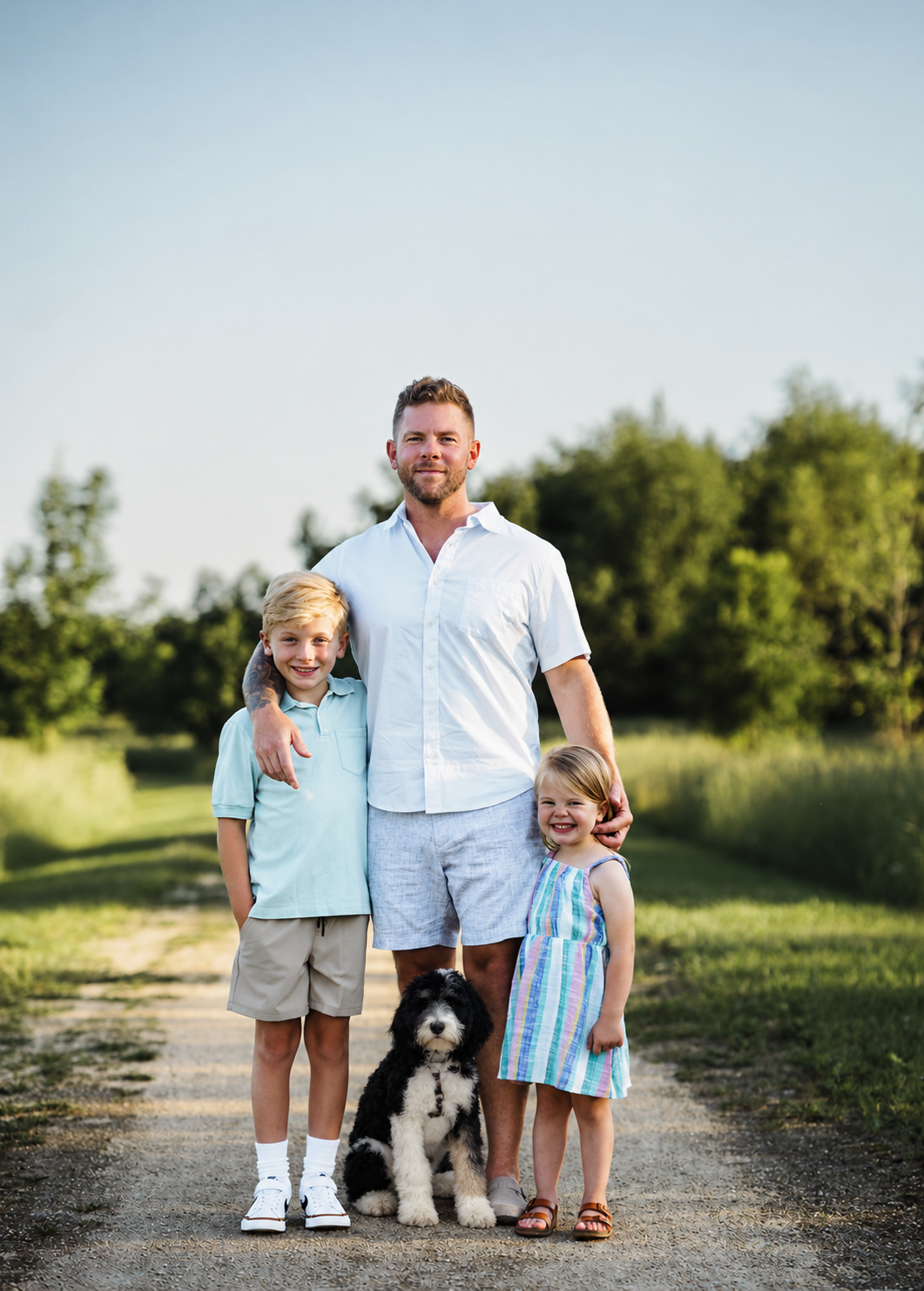 Matt with his son Beckham, daughter Evelyn, and dog Biscuit