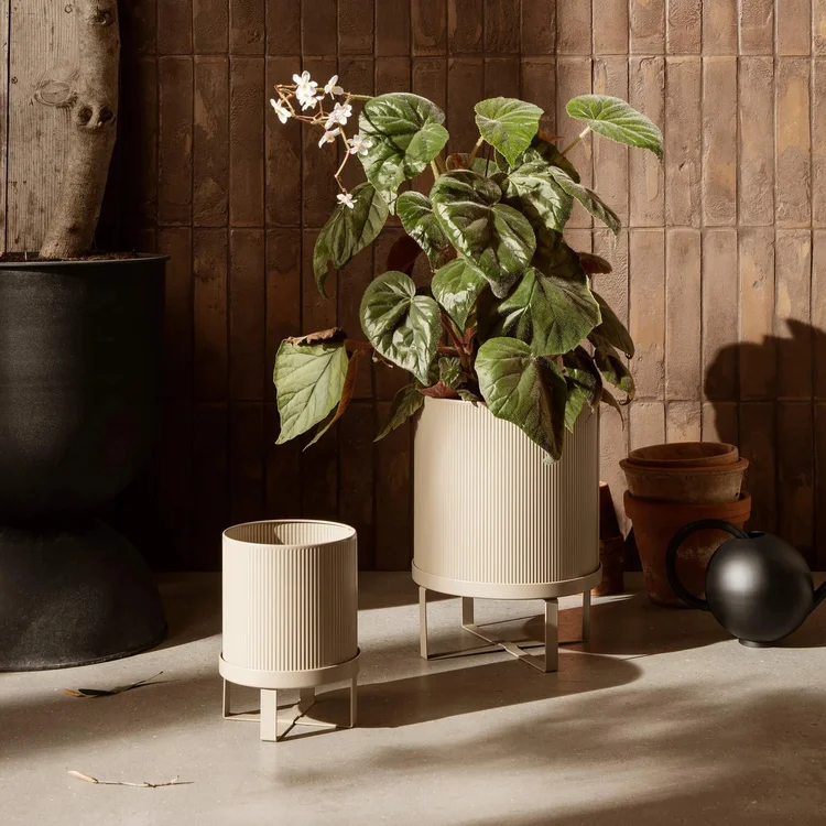 Ribbed metal planters on stands