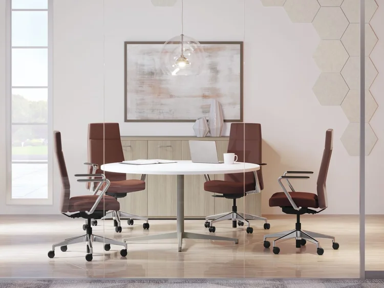 High-back chairs around a round conference table