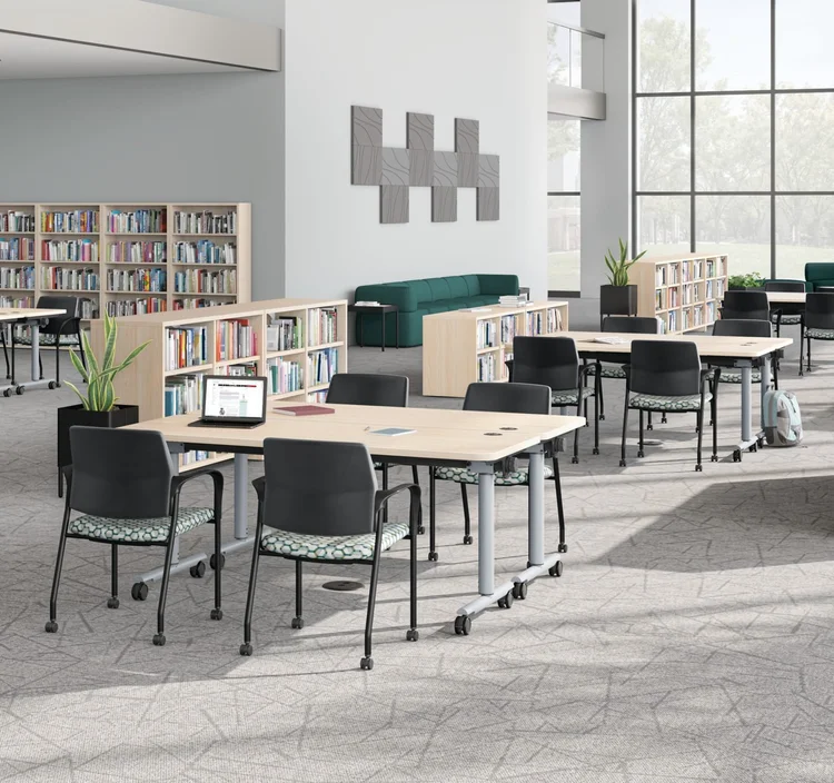 Library with training tables and a teal sectional
