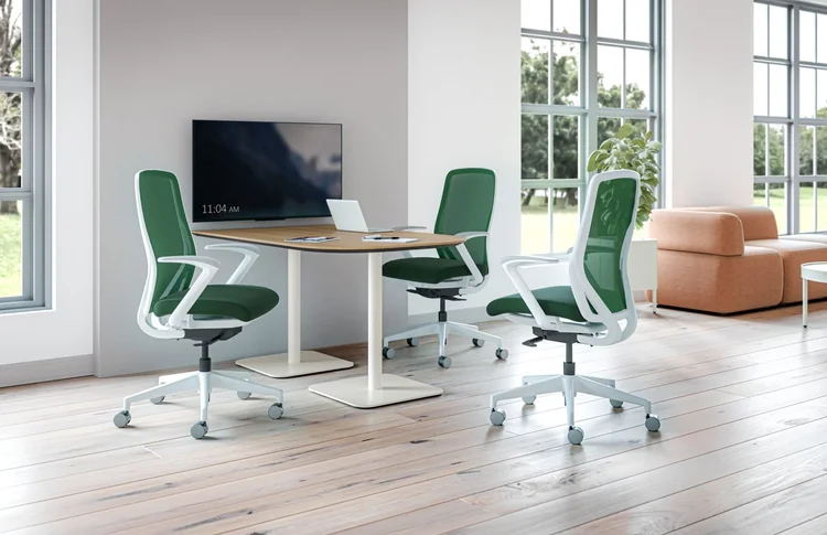 Green mesh task chairs at a meeting table