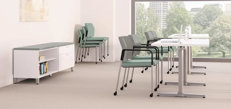 Stacking guest chairs at training tables