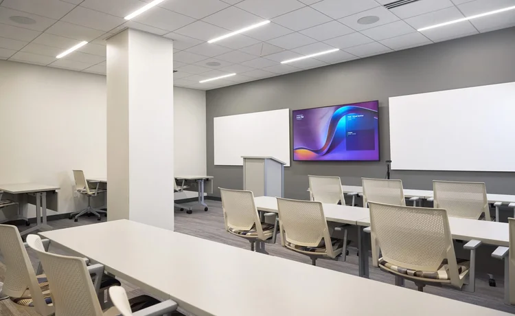 Classroom training tables with white mesh chairs
