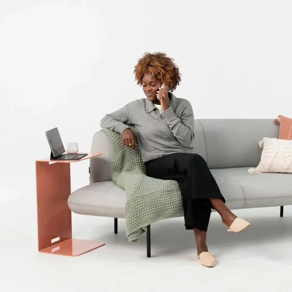 C-shaped side table beside a lounge sofa