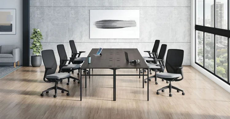 Conference table with black mesh chairs