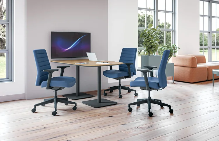 Small meeting table with blue task chairs