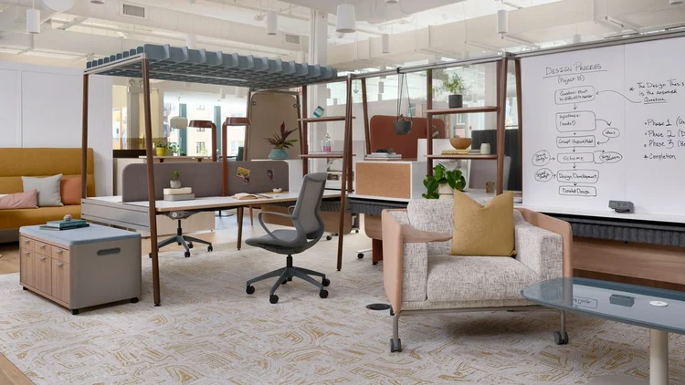 Open studio with canopy workstations and lounge chair
