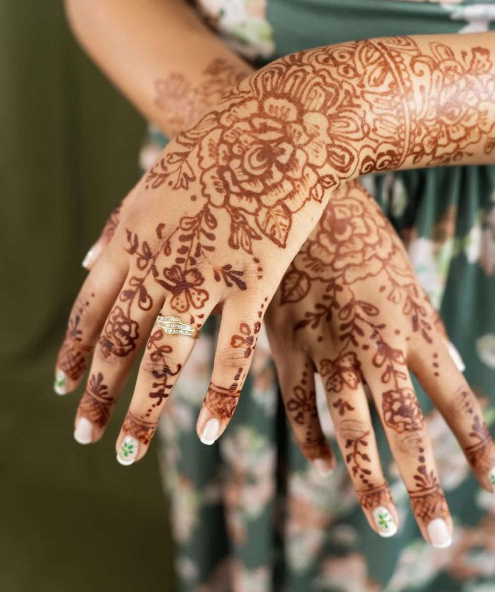 Close-up of intricate mehndi on two hands