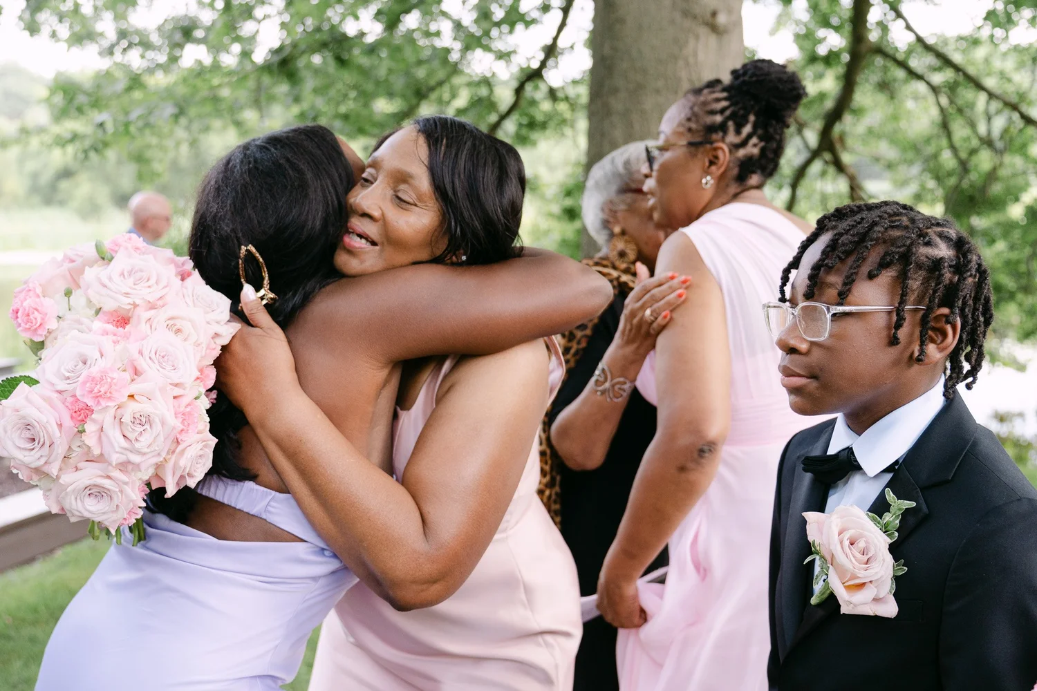 Bridesmaids hugging with joy