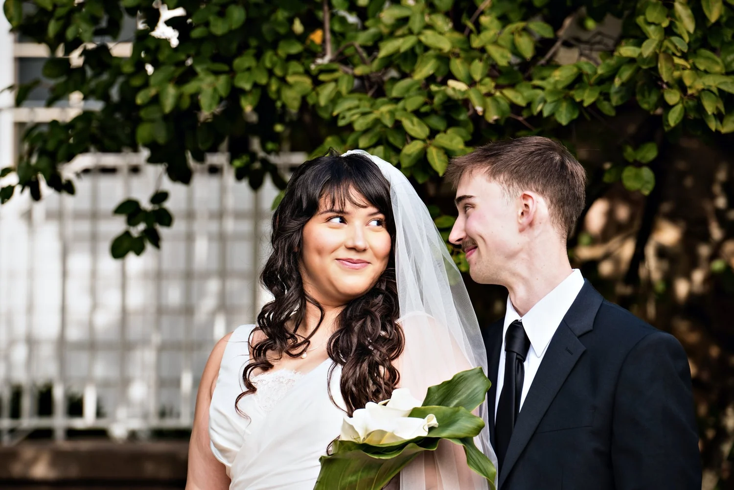 Bride smiling up at the groom