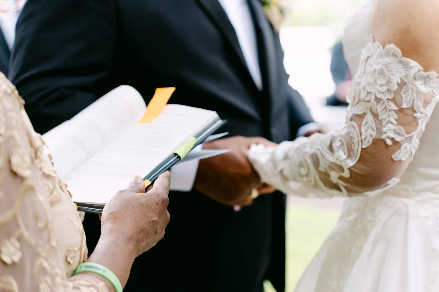 Groom reading vows from a vow book