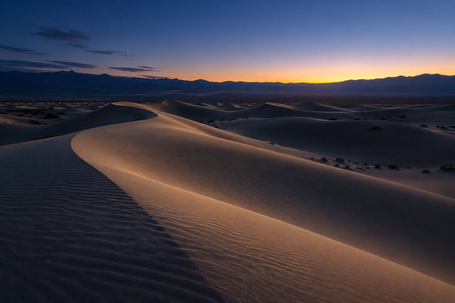 Illustrative sculpted sand dunes beneath an indigo sky at dawn.