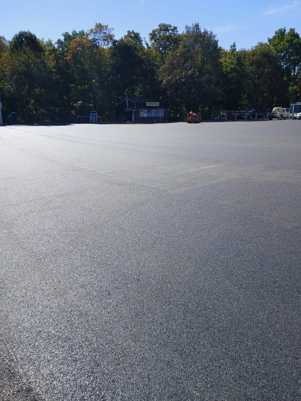 Smooth new asphalt on a large commercial lot