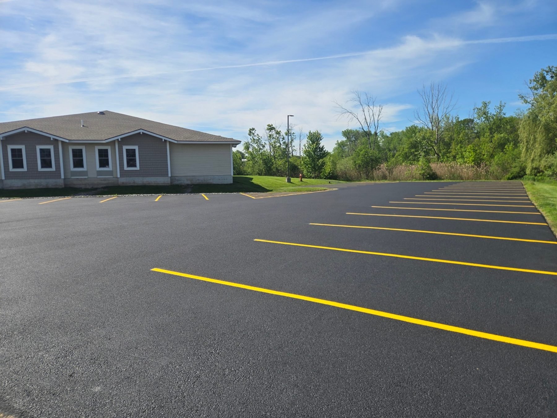 Long row of restriped spaces on a freshly sealed lot