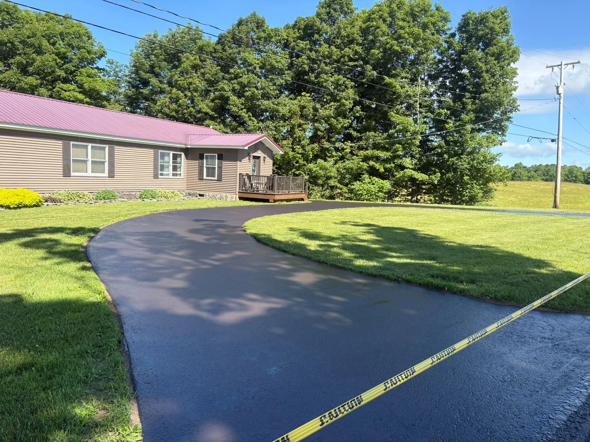 Curved driveway after sealcoating